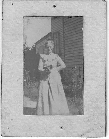 Photo_Unknown Portraits_young woman w flowers at home